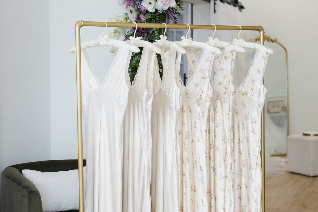 bridal slip dresses hanging on a clothing rack